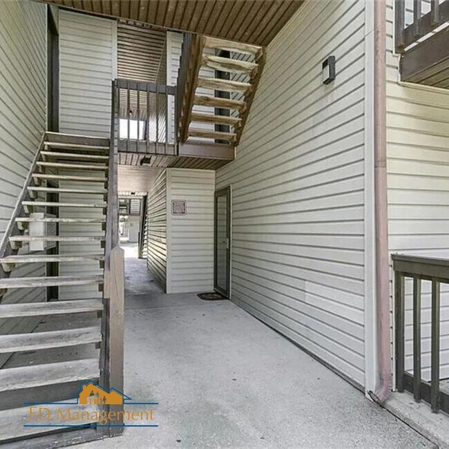 Building Photo - Modern First-Floor with Private Patio in Hampton Club