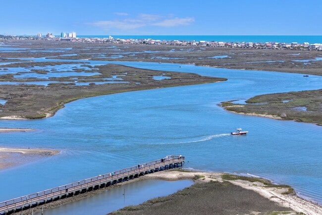 Building Photo - Live the Coastal Lifestyle in This Cypress Keys Beauty!