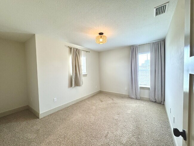 Building Photo - Need Space?  How about 5 bedrooms, 2.5 baths + an extra bonus area upstairs so that the kids can ...
