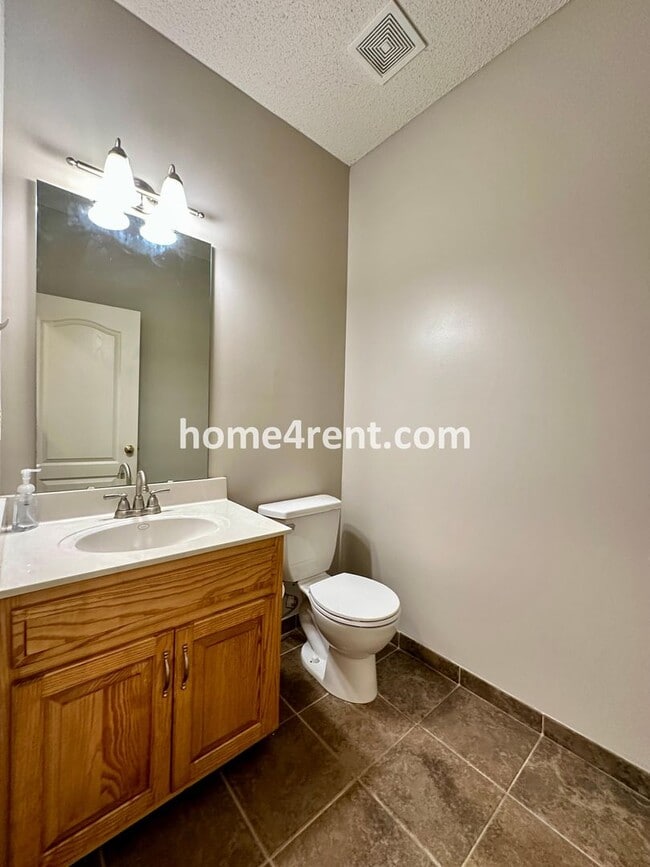 Building Photo - Beautiful Four-Bedroom Home with Three Car Garage, Wood Floors, Finished Basement and a Fenced Ya...