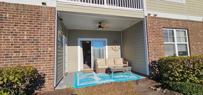 Building Photo - Stunning First-Floor, Fully Furnished Condo with Pond Views