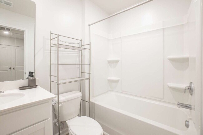 Building Photo - Partially furnished and now available!
