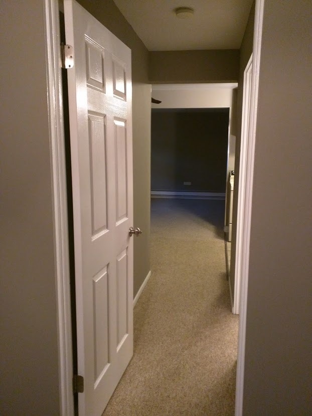 Hallway from bedroom to family room - 8801 Schneider Ave