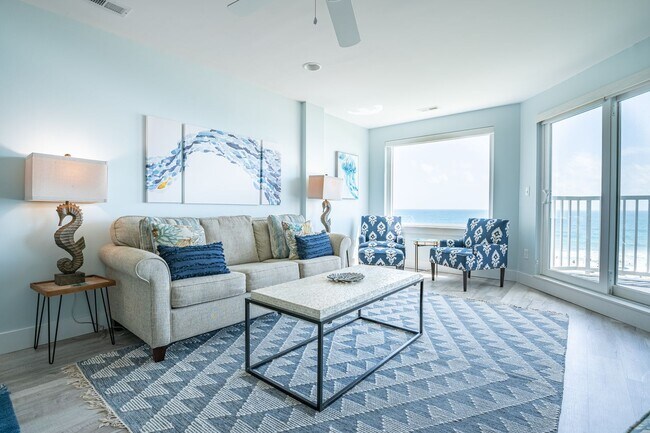 Building Photo - SPEND YOUR OFF-SEASON AT THIS TOP FLOOR OCEANFRONT CONDO