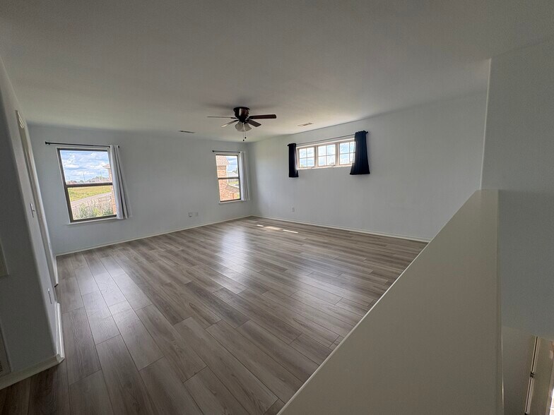 Light & bright second living area upstairs has its own storage closet - 4208 SW Fieldstone Blvd