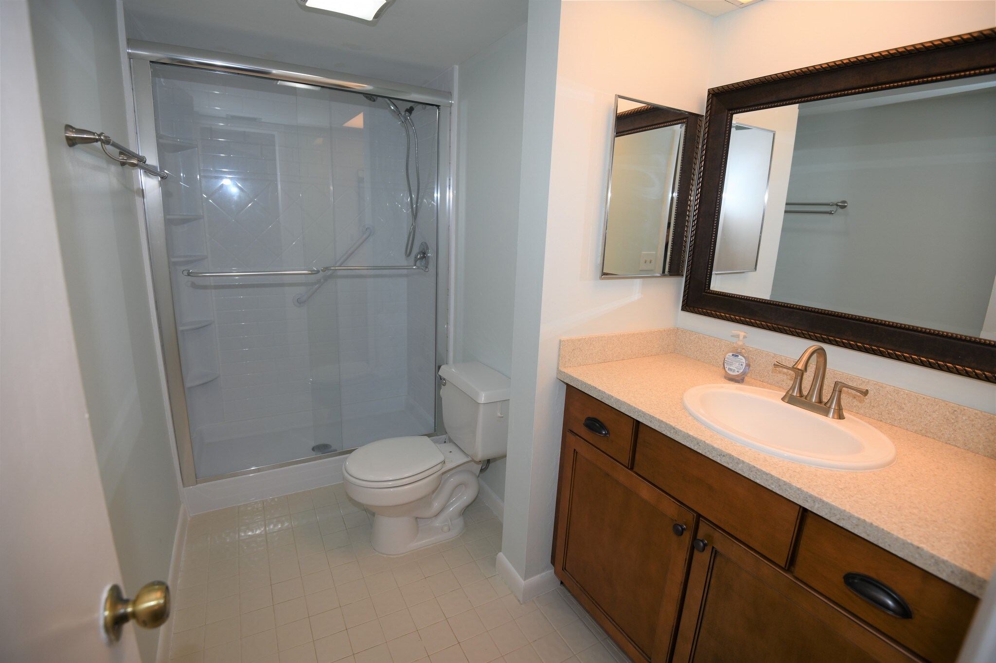Remodeled master bathroom with Corian countertop. - 1291 SE Parkview Pl