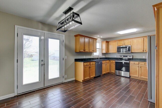 Building Photo - Four Bedroom with Bonus Room and a detache...