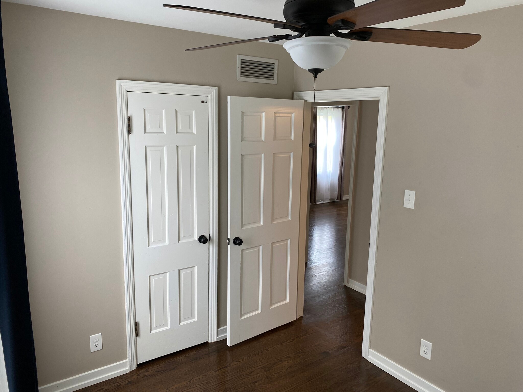 Bedroom 1 w/ceiling fan & hardwood floors - 6717 Huron Ave