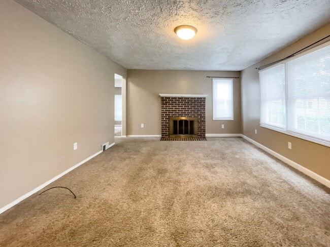 Building Photo - PRELEASING for AUGUST! Walk to Ball State! Bright 4BR Home with Fireplace