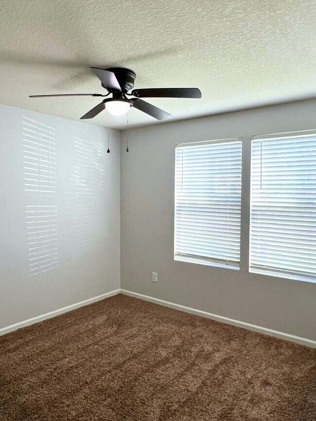 Building Photo - Stylish 4-Bedroom Home with Fenced Yard – ...