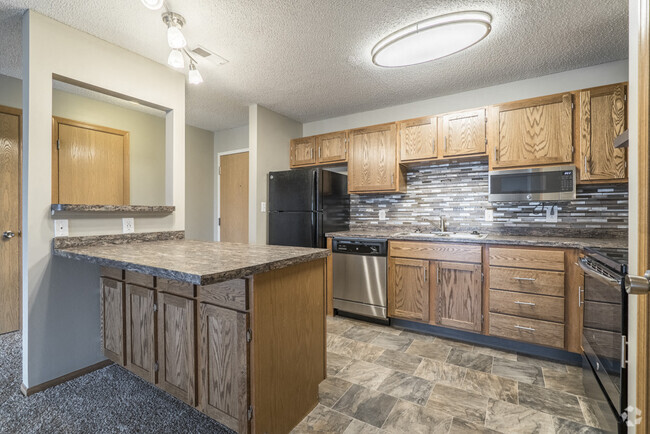 Our renovated apartments feature updated cabinetry, countertops, appliances and tile backsplash. - Highland View Apartments