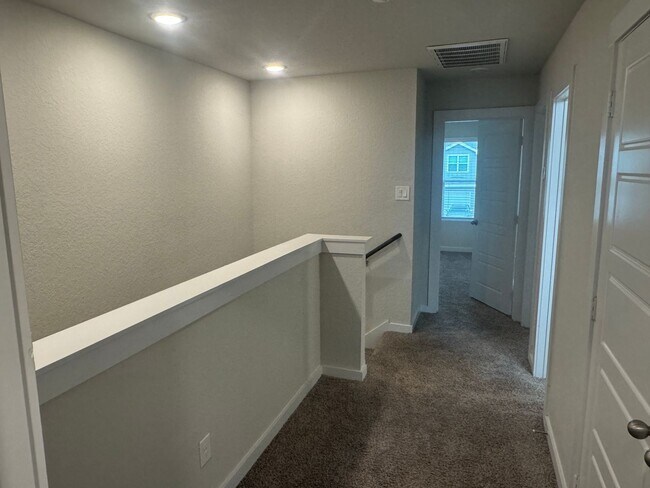 Building Photo - Stylish, Spacious & Close to It All – Your Ideal Townhome Awaits!