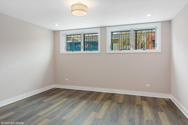 Building Photo - Condo Quality 3,400 SF Duplex Down in Roscoe Village, Pet Friendly Available August 1st