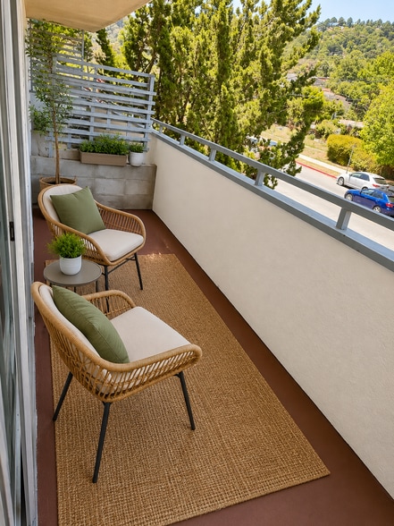 Private balcony overlooking mature trees—perfect for morning coffee, fresh air, or unwinding after a - 2614 Warring Street