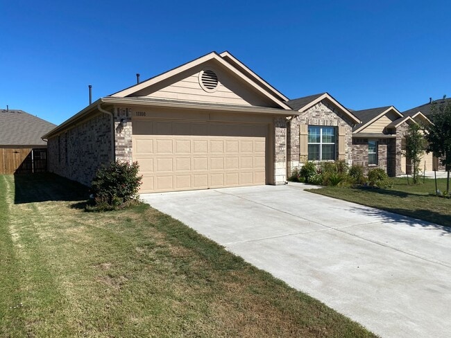 Building Photo - Three Bedroom, Two Bath, Two Car Garage, Washer and Dryer are included.