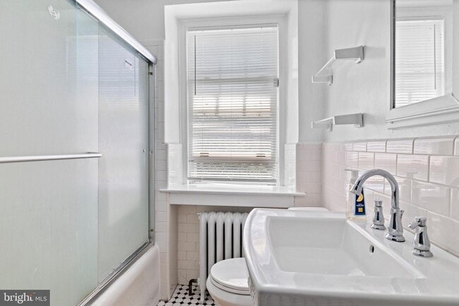 Building Photo - Welcome to this sunny and updated 4-bedroom, 2-bath row home in the heart of Mt. Airy! W/D! Large...