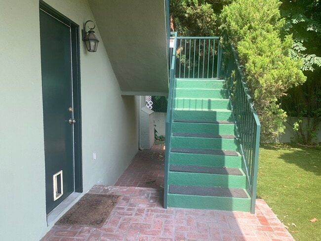 Up the first set of stairs - 14715 Greenleaf St