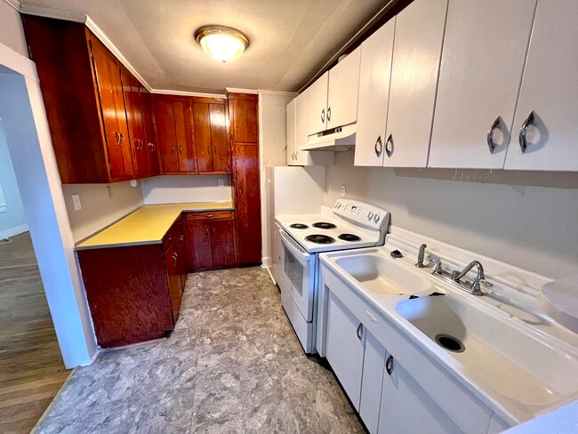 Kitchen with Cabinets - 806 E 9th St
