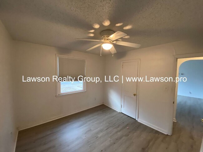 Building Photo - Well Maintained Three Bedroom with Fenced Yard and Shed
