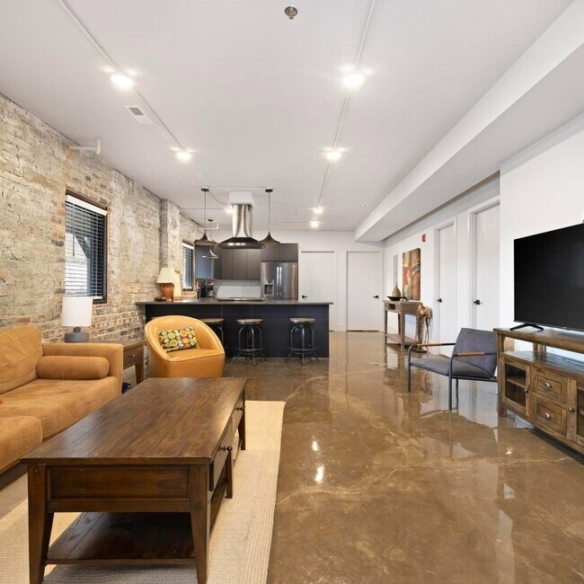 Living Room with exposed brick - 14 Bank St