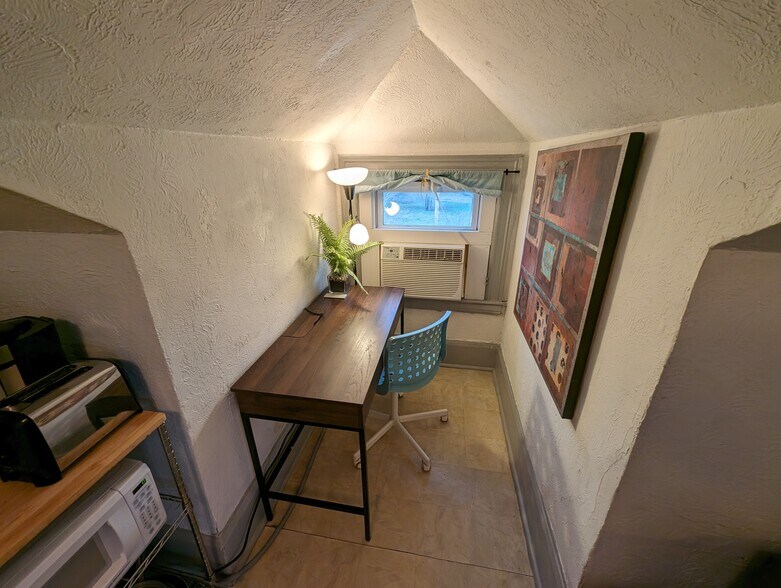 Desk stays furnished, can be stored away if not wanted - 3404 Baltimore Ave