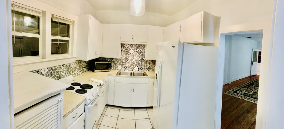 Right kitchen with new light fixtures overlooking your personal deck - 1108 22nd St W