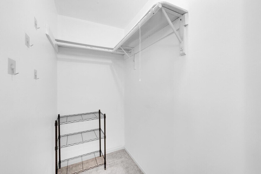 Spacious walk-in closet offering ample storage and organization options. - 3320 Richmond Ct