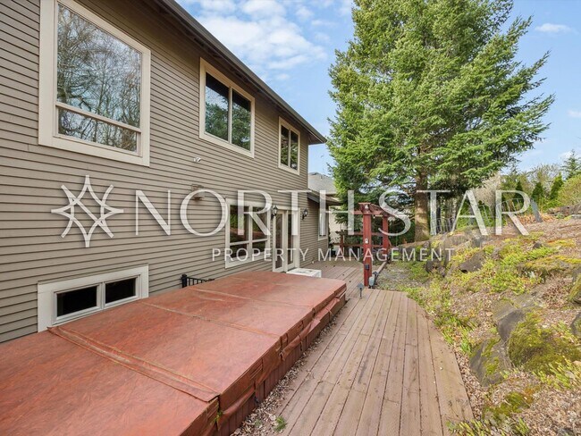 Building Photo - Elevated Forest Heights Retreat with Stunning Valley Views & Versatile Living Spaces