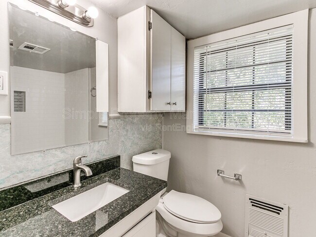 Building Photo - 9706 N Garnett Dr