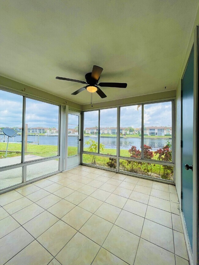 Building Photo - Updated 2-bedroom waterfront duplex with walk-in closets, enclosed Florida room, and canal views ...