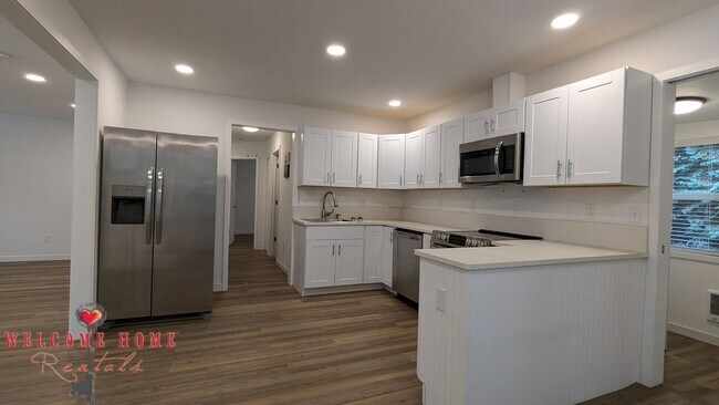 Building Photo - 4 bedroom home with air conditioning - Great location!!!  HUGE basement for your man cave or she ...