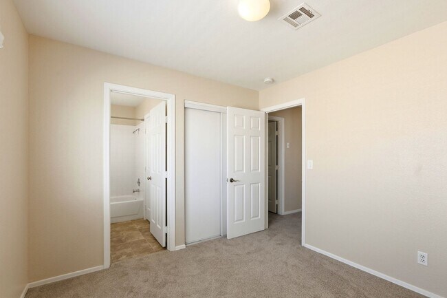 Building Photo - 4 bedroom with NO HOA! New Appliances & New Carpet!