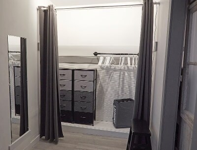 Expansive closet with drawers, hanging area, curtain "doors" and full-sized mirror. - 9 May St