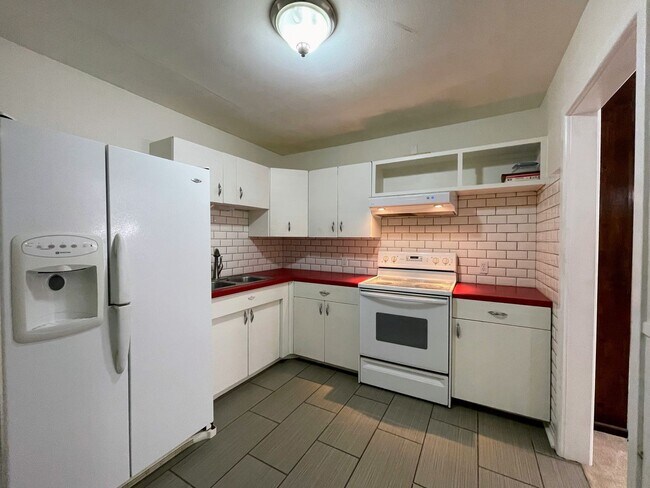 Building Photo - Your New Snyder Sanctuary: Modern Updates, Massive Storage & a Cozy Porch