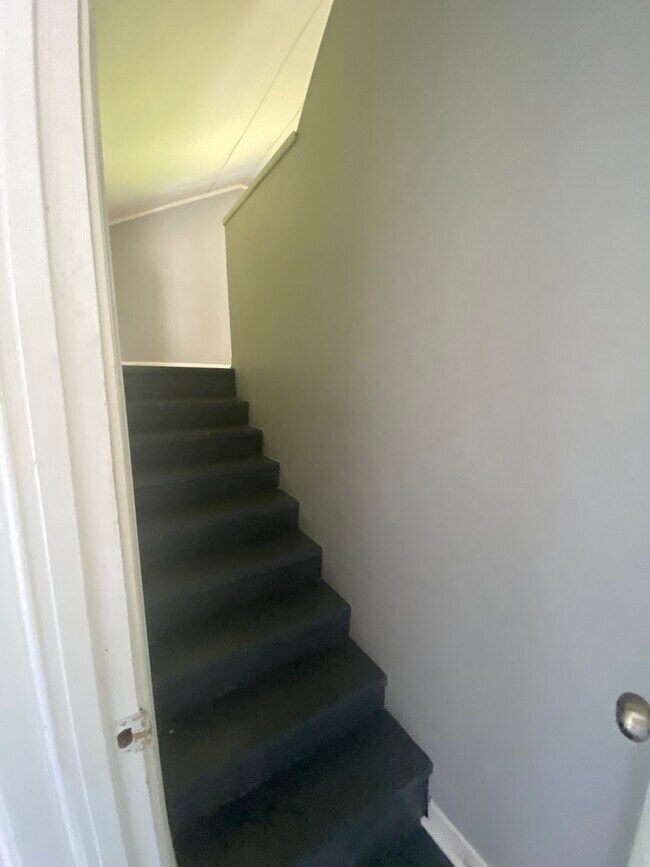 Stairs to bonus room from laundry room - 776 Valley Dr