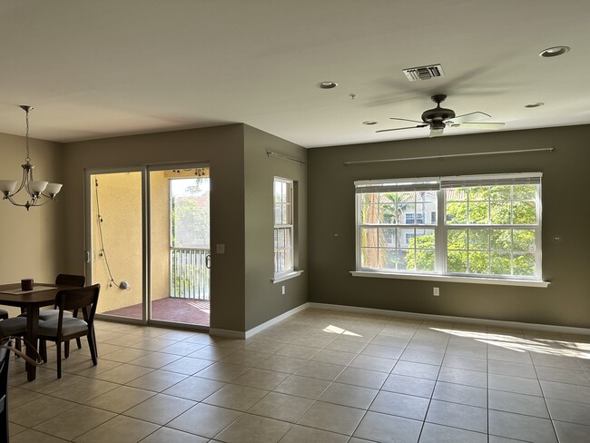 Combined living and dining area with screened porch - 127 Explorer Dr