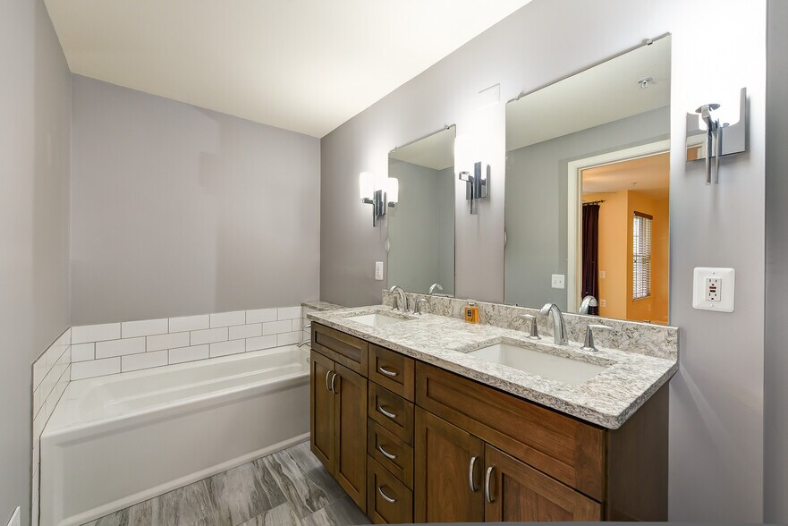 Master bathroom with double sink and separate shower. - 1405 Roundhouse Lane