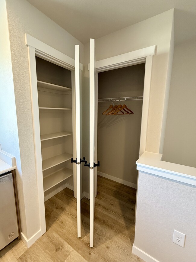 The side-by-side pantry and coat closet provide convenient, organized storage for food and outerwear - 6125 Lantana Light Vw