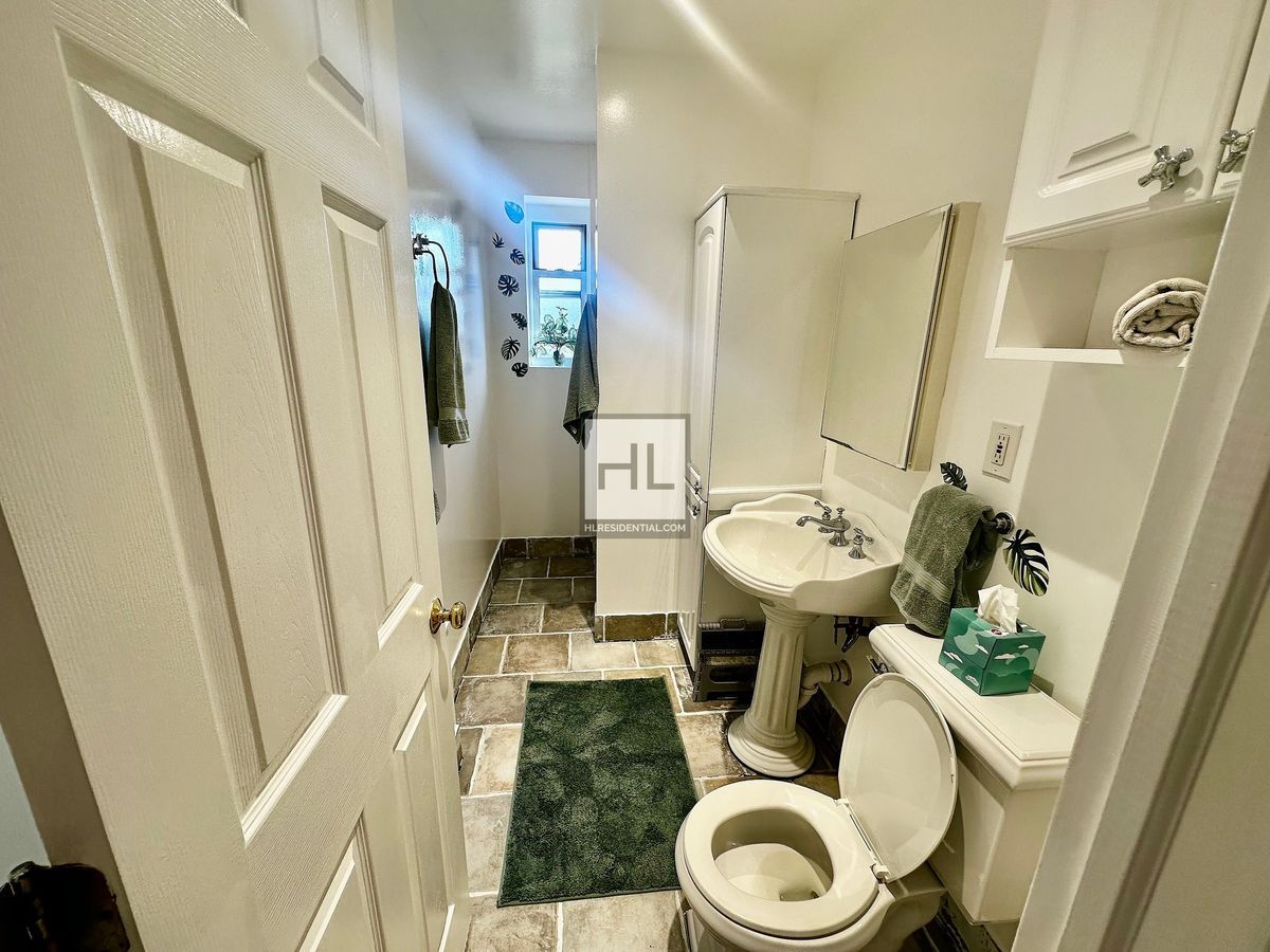 Building Photo - No Fee! Sun-Drenched 2-Bedroom Duplex with...