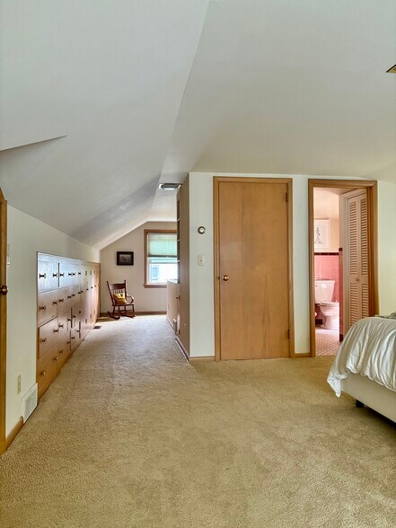 Second floor bedroom includes 4+ closets, 2 built-in desks, half bath and custom blinds - 4112 Gladstone St