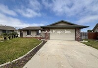 Building Photo - Spacious fenced yard - Three bedroom home ...