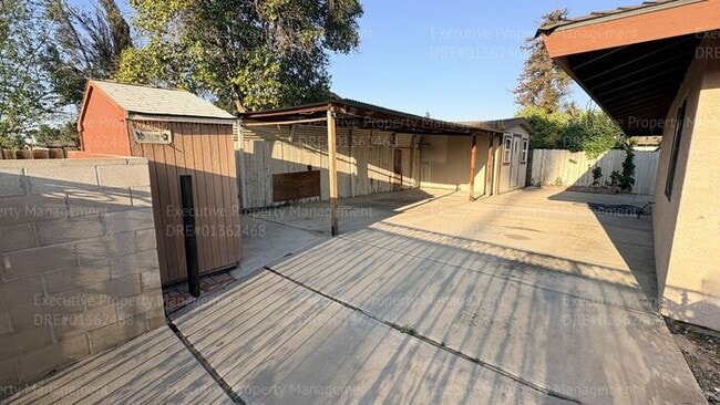 Building Photo - 3 bedroom 2 bathroom home on a corner lot with extra fenced parking.