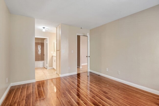 Building Photo - Beautiful 2 Primary Bedroom Downstairs Unit in Gated Community With Pool!