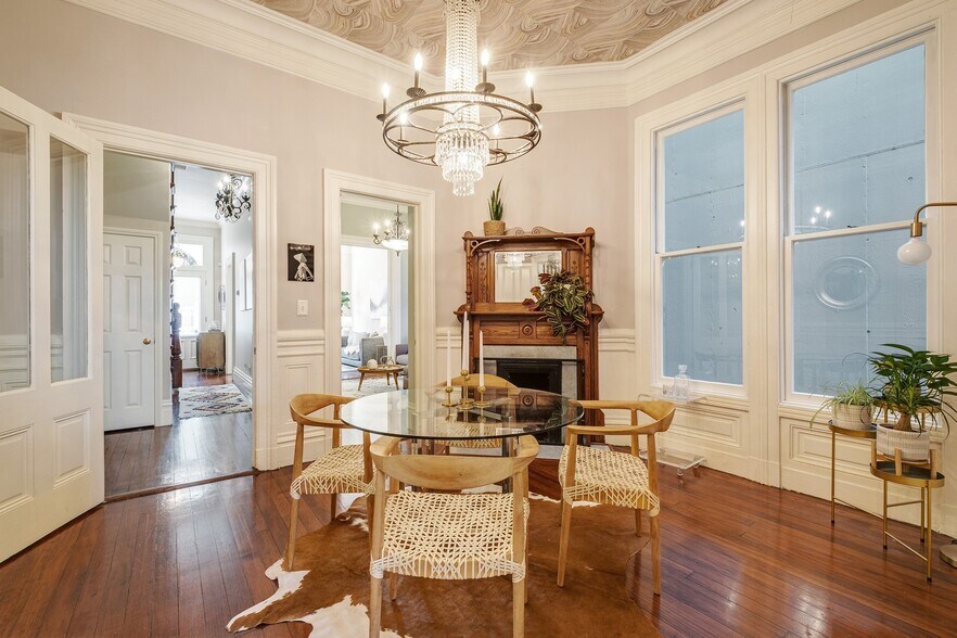 Dining room with fine crystal chandelier and wood burning fireplace - 2188 Sutter St
