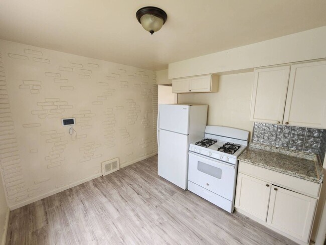 Building Photo - Move-In Special: Save $300 on This Charmin...