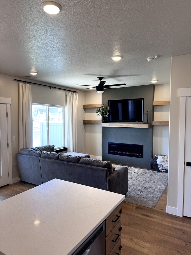 Living Room w/ Electric Fireplace - 3391 S Erin Ave