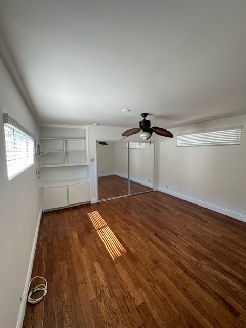 Wow! 14 x 14 large bedroom with large mirrored closet, ceiling fan and beautiful floors - 5545 1/2 Allott Ave