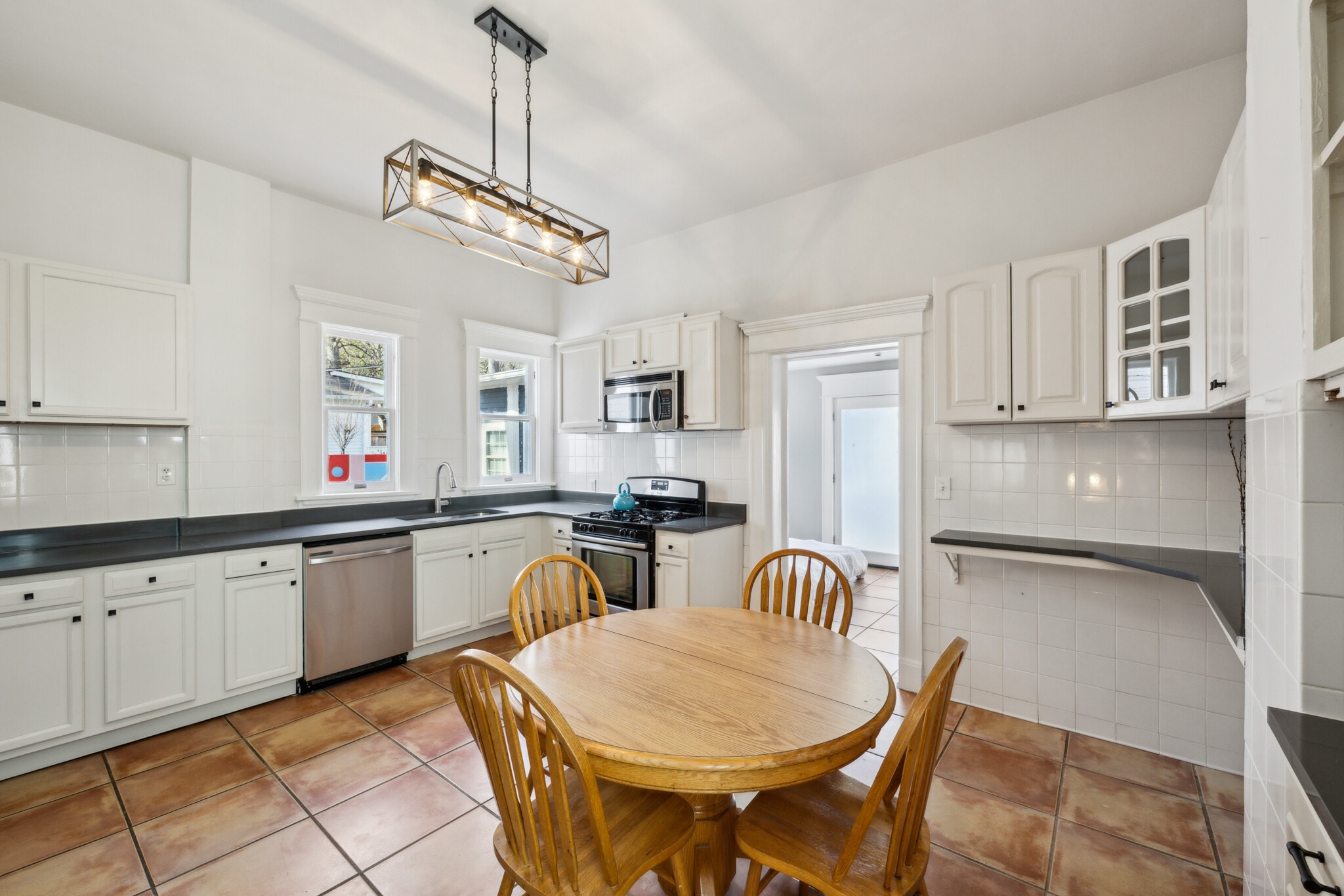 Large Eat in Kitchen includes gas stove, microwave, dishwasher and ample storage - 1118 Colquitt Ave NE