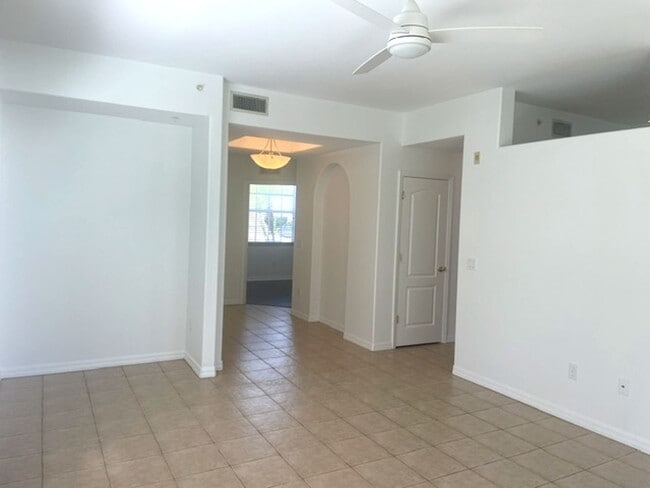 Building Photo - Elegant 3 Bedroom End-Unit Condo with Screened Lanai & Pond Views and A Private Garage