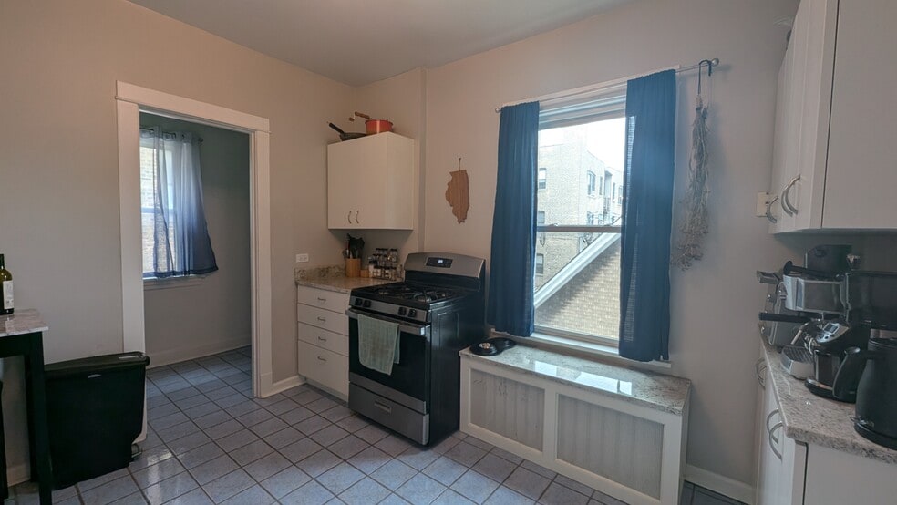 Kitchen with pantry on the left - 2176 W Windsor Ave
